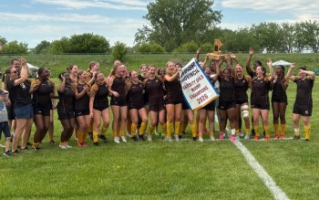 The SRSS Sabres lift the trophy following their victory in the provincial rugby championships June 6. (Sabres Athletics)