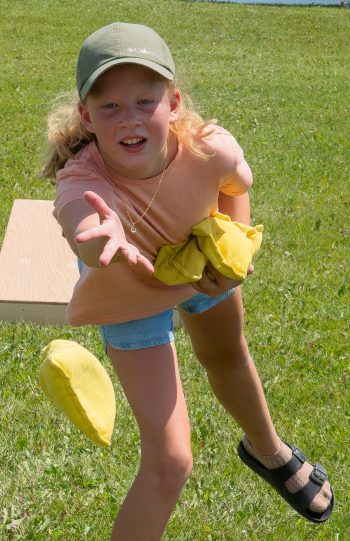SVJETLANA MLINAREVIC THE CARILLON
Emily Peters tosses her bean bag during a round of cornhole  during Mitchell Fun Days at Stahn Field Park on July 11, 2026. Despite the heat reaching a high of 34C, with humidex values near 42, kids had fun playing all the activities.