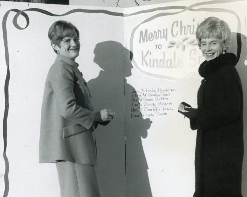 CARILLON ARCHIVES 

In 1967, Kinettes Sandy Gatten and Roslyn Toews add another name to the giant Christmas card at the Steinbach Post Office. Over the years, money raised by donations to collection boxes at Steinbach stores went to support Kindale School and the Kindale Occupational Centre.