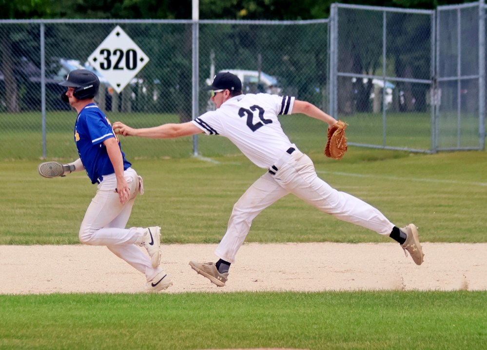 Drew Heide tags out a St Boniface runner after one of three successful pickoff throws from Connor Martin in game three of the MJBL semi-finals July 19 at A.D. Penner Park in Steinbach. (Cassidy Dankochik The Carillon)