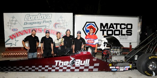 The crew of Grunthal dragster The Bull in the winners’ circle at Cordova Dragway Park in Illinois after the 3,500 horsepower monster won the quarter-mile final in 5.379 seconds and 267.96 mph. From left; Dave Bakx, Rob Schultz, Gord Gingles (driver), Cliff Bakx, Scott Gusey and NHRA representative Matt Levonas.