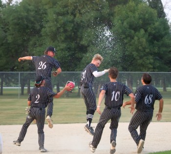 Joe Plett's two-run single not only beat the Elmwood Giants, but also the setting sun, clinching a 12-2 mercy rule victory and setting off massive celebrations inside A.D. Penner Park. (Cassidy Dankochik The Carillon)