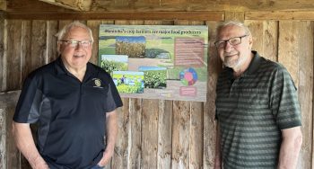 SUPPLIED PHOTO 
The EastMenn Historical Committee installed an information panel dealing with Manitoba agriculture at the Chortitz Church near Randolph. The panel was supported by a grant from South Eastman Rotary, represented here by George Penner, left, and designed by Glen Klassen, right. The site is Waypoint 7 on the Peace Trail.