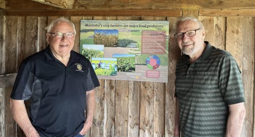 SUPPLIED PHOTO 
The EastMenn Historical Committee installed an information panel dealing with Manitoba agriculture at the Chortitz Church near Randolph. The panel was supported by a grant from South Eastman Rotary, represented here by George Penner, left, and designed by Glen Klassen, right. The site is Waypoint 7 on the Peace Trail.
