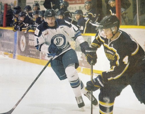 Cole Smith forechecks a Winnipeg Blues player during MJHL action in late 2015. (Terry Frey Carillon Archives)