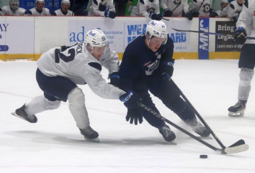 Owen Martin battles with 2026 Winnipeg Jets first rounder Viggo Bjorck during the closing scrimmage July 3 at the NHL team's development camp. (Cassidy Dankochik The Carillon)