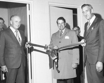 CARILLON ARCHIVES 

Dr. Steve Sonya and South East Veterinary Clinic board chairman Ben Hiebert hold the ribbon for Manitoba Agriculture Minister Sam Uskiw, who cut the ribbon to officially open the new facility just east of Steinbach in October of 1972.