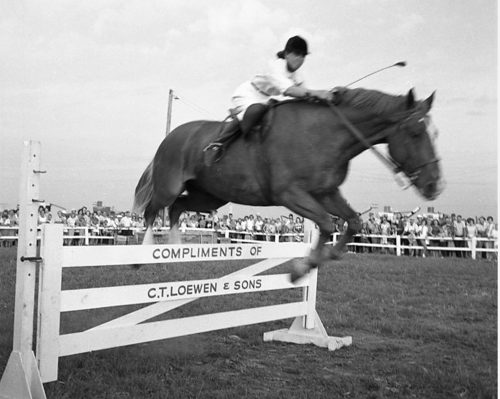 CARILLON ARCHIVES
Variety, competition and showmanship kept interest alive in the Hanover Ag Society horse show. A huge crowd watched riders guide their horses over a variety of obstacles during the horse jumping event at the 1963 and 1964 Hanover Fairs.