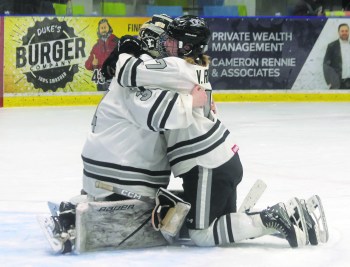 Vayda Rigaux hugs goaltender Addie Tomes after the end of the MFHL championship series. The Eastman Selects fell 3-2 in game four after giving up an overtime goal. (Cassidy Dankochik The Carillon)