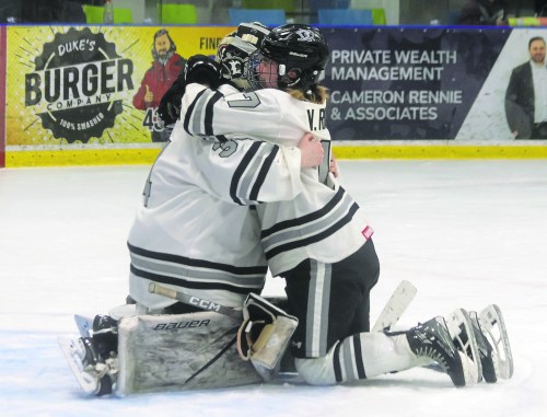 Vayda Rigaux hugs goaltender Addie Tomes after the end of the MFHL championship series. The Eastman Selects fell 3-2 in game four after giving up an overtime goal. (Cassidy Dankochik The Carillon)
