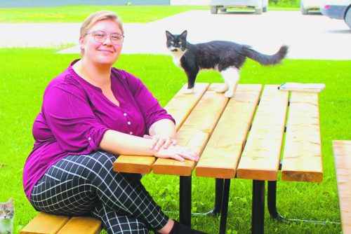 GRAHAM WALKER THE CARILLON 

Carolina Hiebert, one of the co-organizers for the inaugural Light Up the Night Walk, sits at one of the picnic tables produced by SMILE of St Malo. One of these tables will be featured at the event’s silent auction with proceeds being shared between Share-a-Bowl and Agape House.