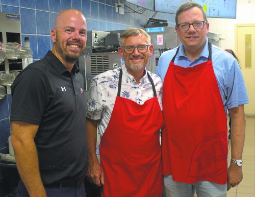 GRAHAM WALKER THE CARILLON 

Left, Dairy Queen owner Steward Holditch joines Steinbach Mayor Earl Funk and city councillor Michael Zwaagstra on the Blizzard machine to help make this year’s Miracle Treat Days another record setter, raising over $12,000 for the Children’s Hospital Foundation of Manitoba.