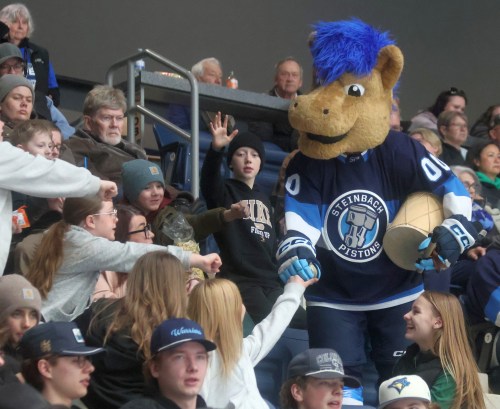 Cassidy Dankochik The Carillon 

Steinbach mascot Clutch interacts with some of the nearly 70,000 fans who took in Pistons games last season during a playoff game.