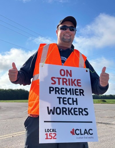 CLAC 

A Premier Horticulture employee gives a thumbs up early in the strike. Employees voted to accept a new offer and are now back at work.