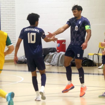 Karan Bhangu (right) celebrates a goal during the Futsal season. (Cassidy Dankochik Carillon Archives)
