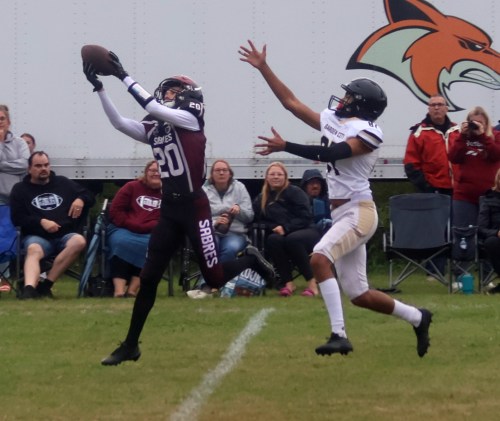 A Springfield Sabres player nabs an interception during a pre-season Winnipeg High School Football League game. (Cassidy Dankochik The Carillon)