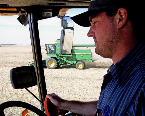 CARILLON ARCHIVES 

Russ Plett of Southeastern Farm Equipment helps Canadian Food Grains Bank harvest grow projects near Steinbach.