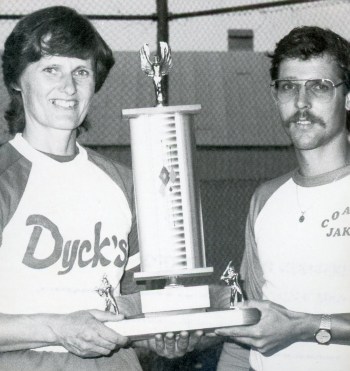 Marge Pauls accepts the Southeastern Ladies Fastball League championship trophy from league president Jake Dyck after the Niverville Angels swept Schmidtke Millwork in three straight games in the 1983 best-of-five final.