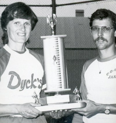 Marge Pauls accepts the Southeastern Ladies Fastball League championship trophy from league president Jake Dyck after the Niverville Angels swept Schmidtke Millwork in three straight games in the 1983 best-of-five final.