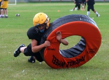 An SRSS Sabres player practices his tackling during training camp. (Cassidy Dankochik The Carillon)