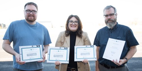 Adi Kapoor The Carillon 

The Carillon sports editor Cassidy Dankochik (left), reporter Svjetlana Mlinarevic, and editor Greg Vandermeulen stand with their CCNA awards on Oct. 21. The Carillon won for Best Sports Photo, Best News Story, Best Historical Story, and second place for Best Local Editorial.