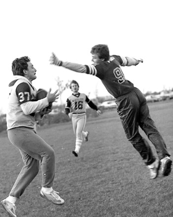 Rod Reimer gathers in a Gary Unger pass just beyond the outstretch arm of L.A. Electrics defender Ryan Penner. Reimer and his teammates caught eight touchdown passes for the Wheelers on the way to a 52-12 win in the championship game of the Steinbach and Area Touch Football League.

-Wes Keating Carillon Archives
