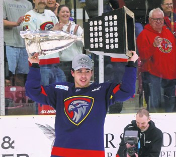 Niverville's Jaden Mah hoists the Turnbull Cup April 23. The 2008-born defenseman helped his hometown team to an MJHL championship. (Cassidy Dankochik The Carillon)