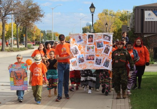 ADI KAPOOR THE CARILLON 

Mino Odewin and community members took part in Orange Shirt Day in Steinbach.